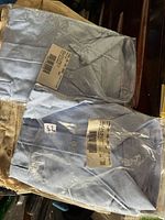 Two sealed light blue OC Transpo uniform shirts