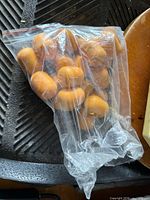 Bag showing multiple Kinder Surprise egg capsules