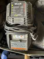 Top view of Ryobi IntelliPort charger showing LEDs, vents and power cord
