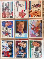 Two binder pages each containing nine Score hockey cards