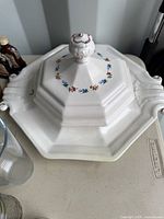 Tureen lid on platter showing overall appearance