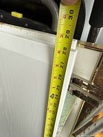 Door measured vertically to show height (~30 in)