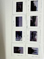 Eight labelled slides showing handwritten dates July 1990 and locations Vienna, Bucharest