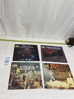 All four book and record sets laid out for overview