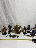 Front view of all six figures with accessories laid out