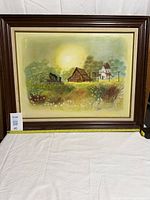 Front view of framed painting with measuring tape