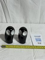Pair of Royal Dux owl figures with ruler for scale