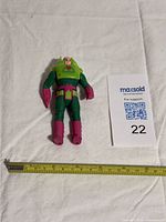 Full figure with ruler for scale and lot label