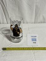 Full view of glass with measuring tape showing height