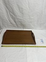 Top view of full tray with measuring tape showing length