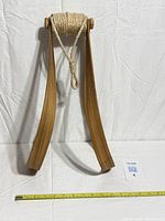 Full view of teak bentwood planter hanger with tape measure for scale