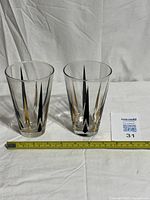 Pair of Anchor Hocking tumblers with measuring tape for scale