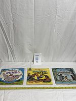 Front covers of all three Disney See Hear Read sets laid side by side