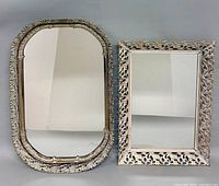 Front view of both ornate silver-tone framed mirrors