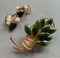 Both brooches front view showing design and stones