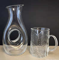 Both glass vessels side by side showing size and design details