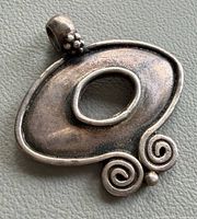 Front view showing design and patina