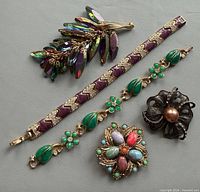 All five jewelry pieces laid out