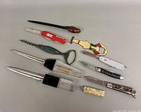 Group of knives, letter openers, corkscrew