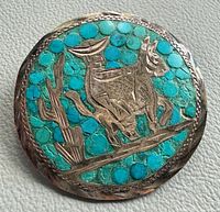 Front view showing turquoise mosaic and silver overlay design