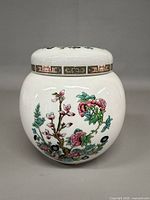 Front view of porcelain ginger jar with lid showing Indian Tree pattern