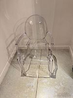front angle view of clear acrylic armchair