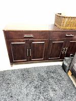 Front view of sideboard closed showing drawers and doors