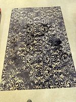 Full view of rug showing overall pattern and wear