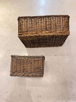 Large and small baskets side by side, top view to show size difference and weave