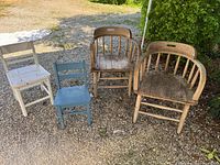 Four chairs grouped outdoors showing types and condition