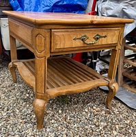Three-quarter view showing full table, drawer, shelf, legs