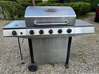 Front view of stainless steel Char-Broil Performance propane grill with closed lid