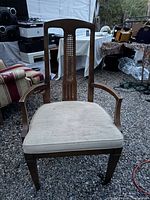 Front view showing full chair, lattice back, arms and seat