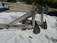 Pair of aluminum ladder jacks on ground