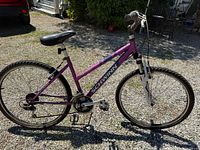 Full side view of purple Schwinn mountain bike