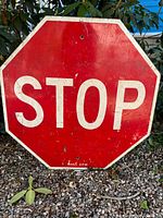 Front of red octagonal stop sign reading STOP