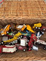 Top view of wicker basket filled with assorted Tonka vehicles
