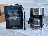 Wine fridge and coffeemaker side by side showing overall condition