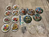 All plates, hangers, nails and plastic sleeves laid out
