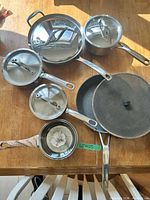 Full layout of all cookware pieces and lids