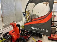 Overall view of Ariens snow blower with attached cab