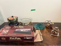 Entire lot on table showing all six items including boxed fire pot