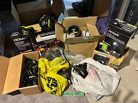 Assortment of boxed and loose outdoor lights and cords