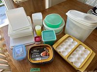 All containers and trays laid out on table