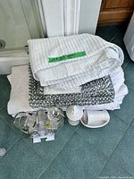 Stacked shower curtain, rug, towel, ceramic accessories, chrome caddy