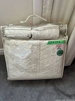 Front view of packaged quilt set showing quilt pattern and included shams