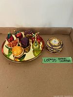 Overview of tray with seven fruit boxes, separate clock box