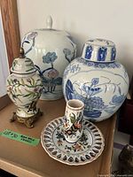 Group shot of both ginger jars, urn, plate, and bud vase