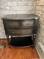 Front angled view showing full nightstand, drawers, shelf and legs