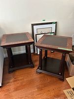 Both square end tables side by side showing tops, legs, shelves